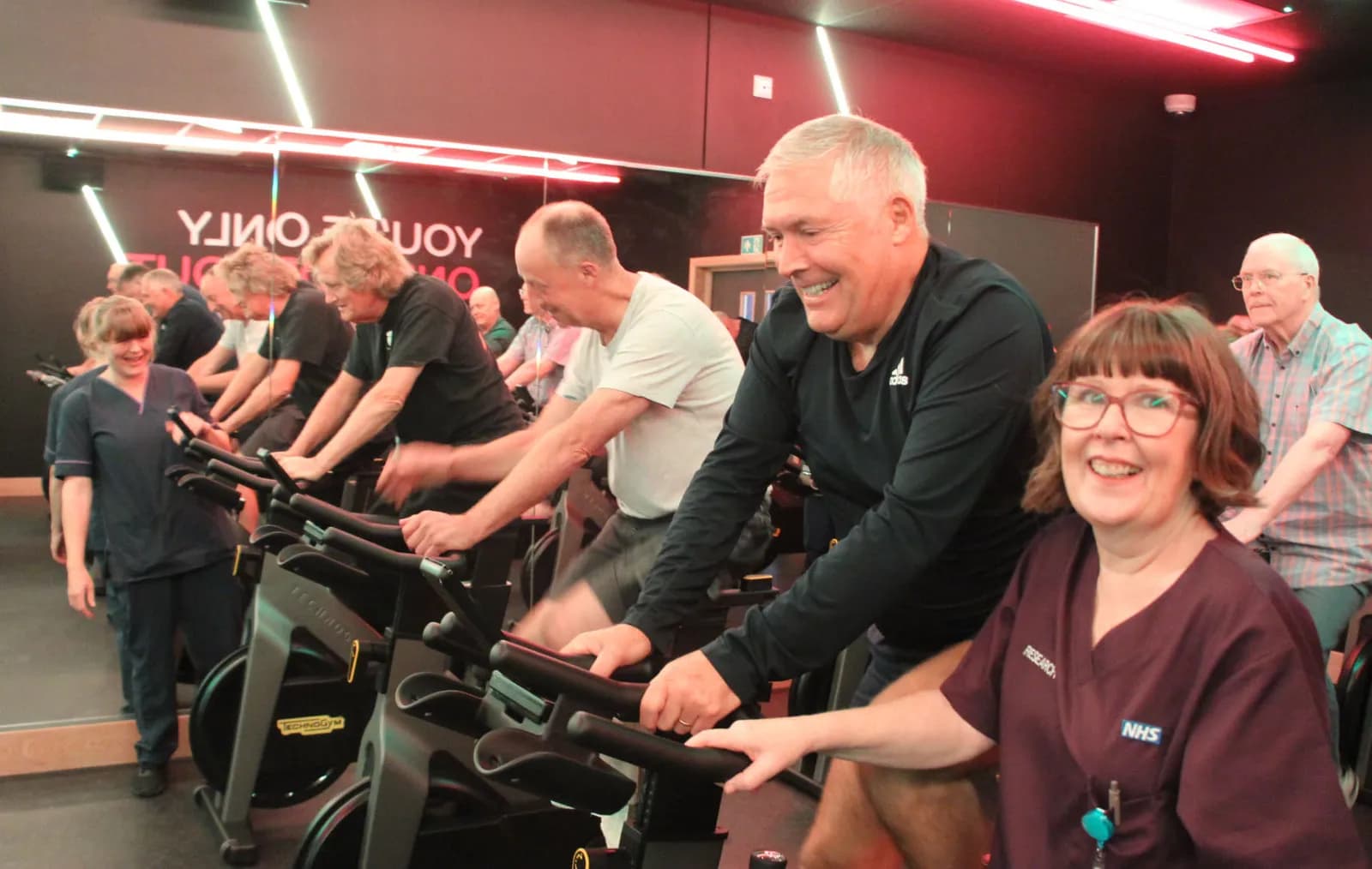 Janine O’Rourke with Mike Ritchie on exercise bike